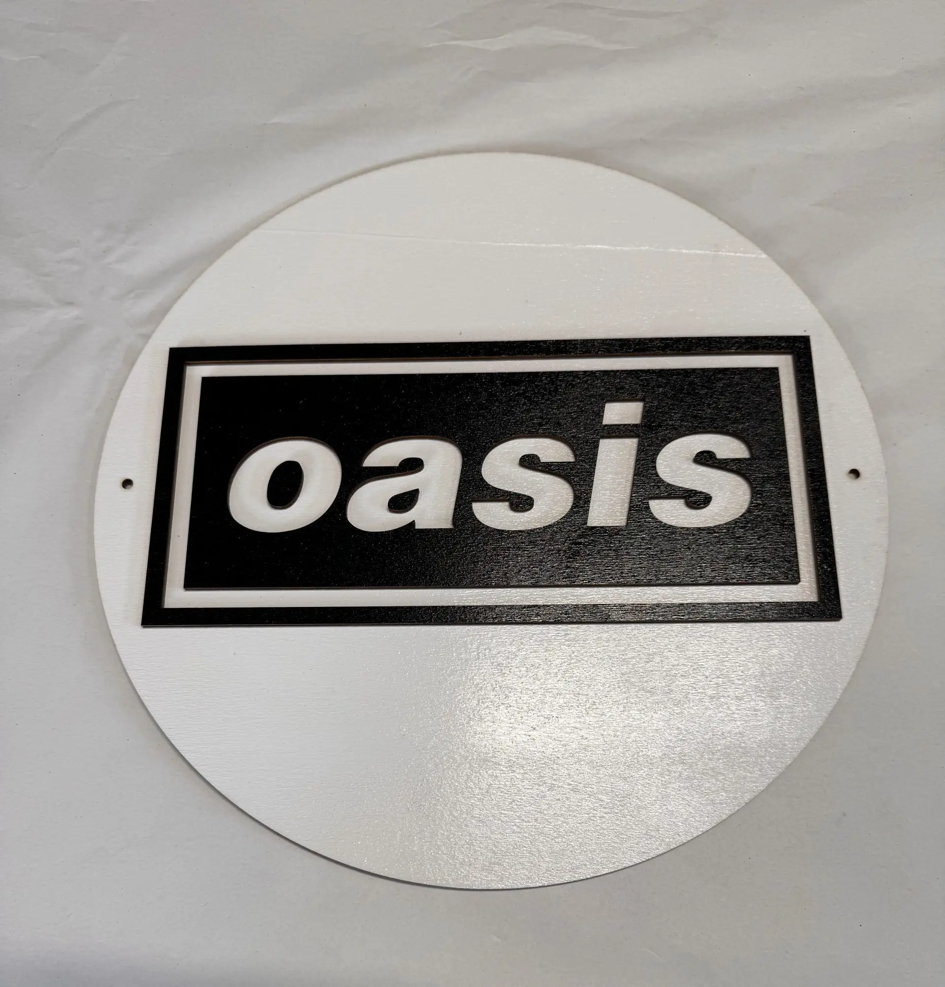 Front view of Oasis wall plaque, 12 inch two‑layer MDF engraved Britpop artwork