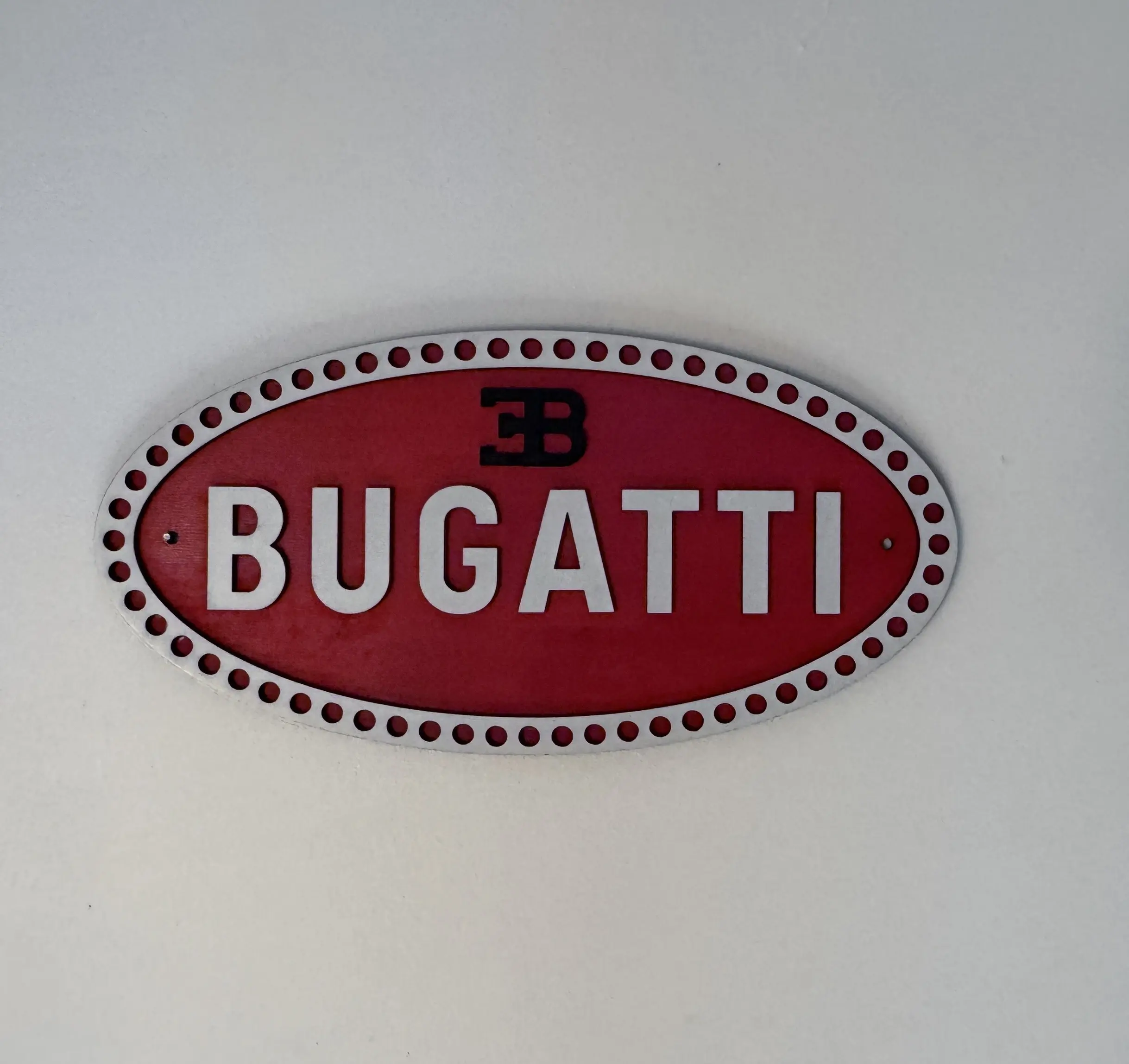 Front view of Bugatti logo sign, 29.5 × 14.5 cm two‑layer MDF engraved automotive artwork