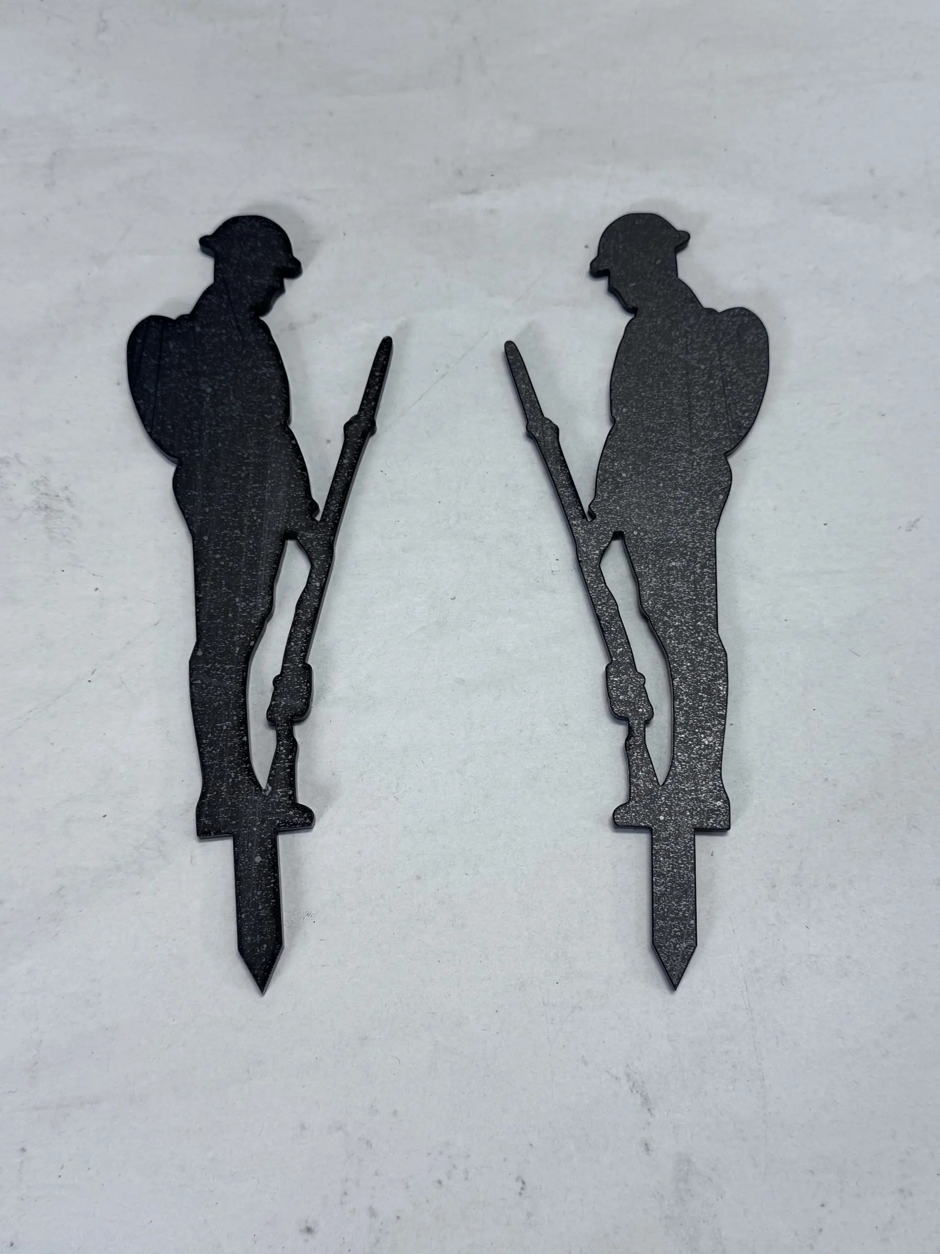 Small 18cm x 6cm gloss black acrylic 'Lest We Forget Sentry 01' stake with pair of soldiers, laser-cut by Boon Hill Designs on white background