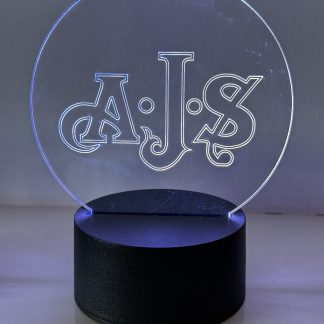 AJS motorcycle logo LED night light with 16‑colour remote‑controlled illumination on acrylic panel.