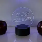 Black Sabbath logo LED night light with 16‑colour remote‑controlled illumination on engraved acrylic panel.
