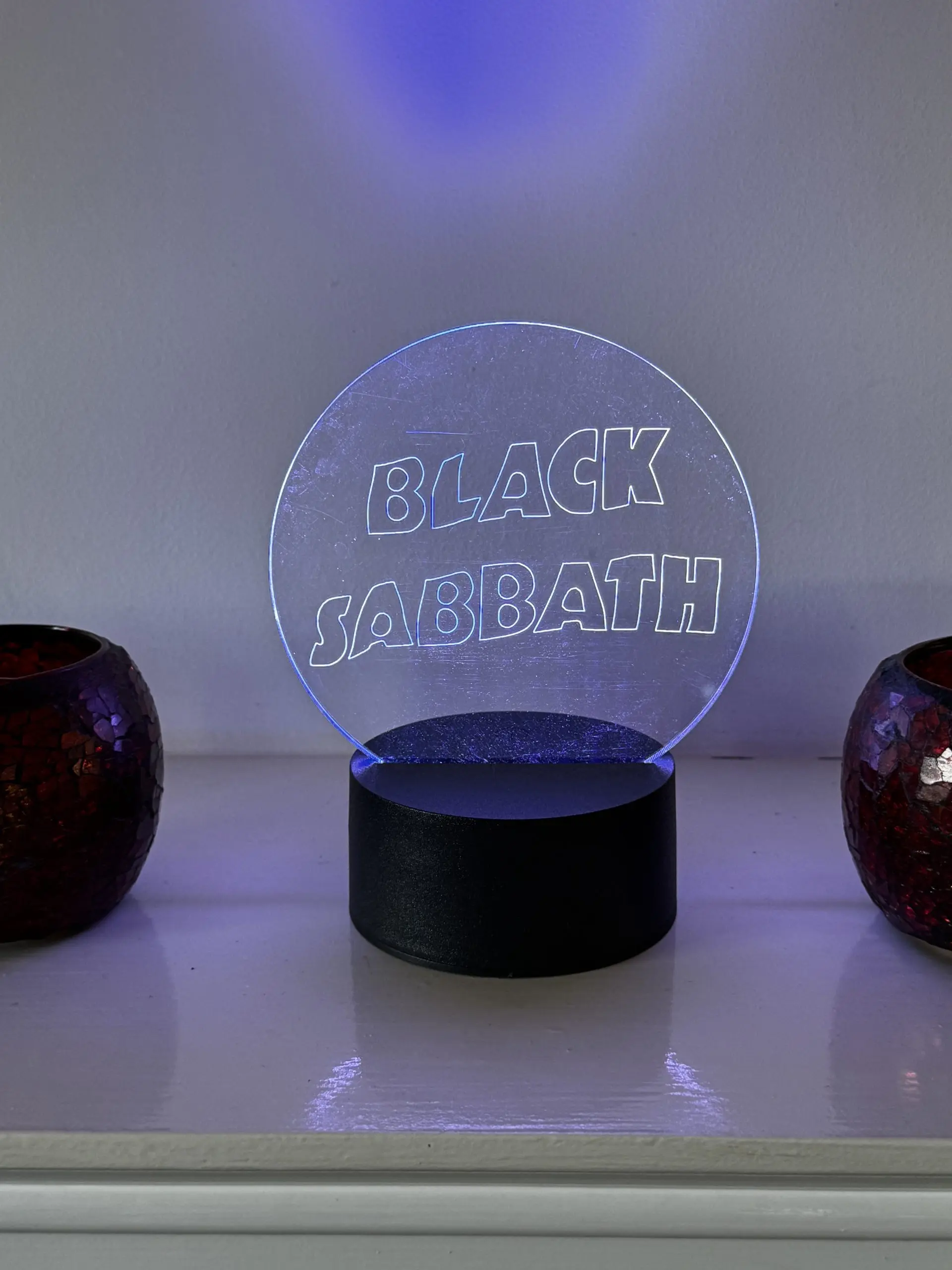 Black Sabbath logo LED night light with 16‑colour remote‑controlled illumination on engraved acrylic panel.
