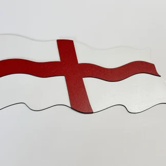A two-layer MDF wall plaque of the England flag, 39.5cm by 27.5cm. A textured red cross is raised above a white base, both cut in a waving flag shape and shown on a plain white background.