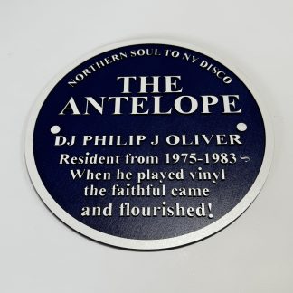 “295mm two‑layer MDF reproduction Blue Plaque commemorating The Antelope and DJ Philip J Oliver, with engraved midnight‑blue faceplate and silver lettering.”