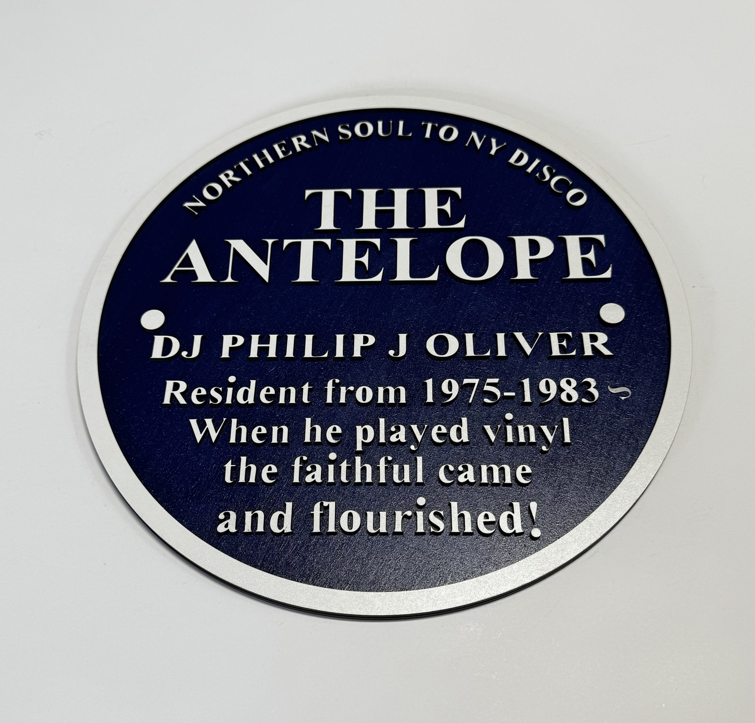 The Antelope – Northern Soul to NY Disco Blue Plaque Reproduction - Boon Hill Designs - Custom Plaques, Signs & Gifts “295mm two‑layer MDF reproduction Blue Plaque commemorating The Antelope and DJ Philip J Oliver, with engraved midnight‑blue faceplate and silver lettering.”